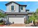 Charming two-story home featuring a well-manicured front yard and an attached two-car garage at 4719 Tramanto Ln, Wesley Chapel, FL 33543