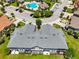 Aerial view of the community, showcasing the building's roof, pool, and landscaped grounds, perfect for relaxation and recreation at 4744 Wandering Way, Wesley Chapel, FL 33544
