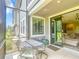 Outdoor patio featuring a decorative table and chairs, and sliding glass door entry to the home's living area at 4744 Wandering Way, Wesley Chapel, FL 33544