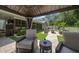 Backyard patio area with furniture, a manicured lawn, and covered patio at 4765 Lake Valencia W Blvd, Palm Harbor, FL 34684