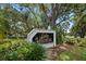 Entrance sign for Lake Valencia West, framed by lush greenery and trees, inviting a serene community feel at 4765 Lake Valencia W Blvd, Palm Harbor, FL 34684
