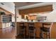 Charming kitchen with wooden cabinets, stainless steel appliances, and a breakfast bar with stool seating at 4765 Lake Valencia W Blvd, Palm Harbor, FL 34684