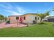 Spacious backyard features well-maintained lawn and brick patio, perfect for outdoor entertaining at 4932 Murray Hill Dr, Tampa, FL 33615