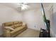 Bedroom with a couch and TV at 4932 Murray Hill Dr, Tampa, FL 33615