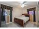 Cozy bedroom with ornate window treatments and a full size bed at 4932 Murray Hill Dr, Tampa, FL 33615