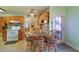 Kitchen with seating area, and light blue walls and wooden cabinets at 4932 Murray Hill Dr, Tampa, FL 33615