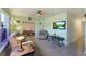 Comfortable living room with light green walls and view into an adjacent room at 4932 Murray Hill Dr, Tampa, FL 33615