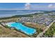 Aerial shot showing lagoon near homes and roads with ocean and green spaces in background at 5917 Cat Claw Ln, Bradenton, FL 34210