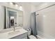 Bathroom featuring a shower-tub combo, vanity, and a walk-in closet at 5917 Cat Claw Ln, Bradenton, FL 34210