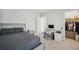 Comfortable bedroom with a bed, desk, and walk-in closet for storage at 5917 Cat Claw Ln, Bradenton, FL 34210