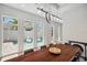 Dining room boasting a wood table and an outdoor view with a refreshing pool at 5917 Cat Claw Ln, Bradenton, FL 34210