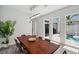 Dining room featuring a wood table and views of the pool and backyard at 5917 Cat Claw Ln, Bradenton, FL 34210