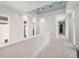 Hallway boasts clerestory windows, recessed lighting, and wood-look flooring at 5917 Cat Claw Ln, Bradenton, FL 34210