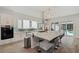 Contemporary kitchen with a large island, stainless steel appliances, and views of the pool at 5917 Cat Claw Ln, Bradenton, FL 34210
