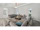 Bright living room with modern furnishings and large windows for natural light at 5917 Cat Claw Ln, Bradenton, FL 34210