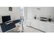 Home office featuring a stylish modern desk, a printer, and a decorative desk plant at 5917 Cat Claw Ln, Bradenton, FL 34210