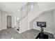 Bright foyer with a modern staircase and wood-look flooring at 5917 Cat Claw Ln, Bradenton, FL 34210