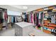 Well-organized walk-in closet featuring custom shelving, hanging rods, and organized boxes at 5917 Cat Claw Ln, Bradenton, FL 34210