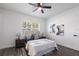 Spacious main bedroom with luxury vinyl floors, white walls, and a large window at 605 Bainbridge Dr, Brandon, FL 33511