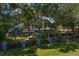 A view of home's backyard featuring lush foliage and mature trees providing ample privacy at 6352 W Maclaurin Dr, Tampa, FL 33647
