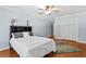 Bedroom with hardwood floors and closet at 6352 W Maclaurin Dr, Tampa, FL 33647