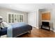 Cozy bedroom with wood floors, shutters, and closet at 6352 W Maclaurin Dr, Tampa, FL 33647