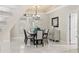 Bright dining room features large windows, modern lighting and stylish furnishings at 6352 W Maclaurin Dr, Tampa, FL 33647