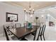 Spacious dining room with views to another room and elegant decor at 6352 W Maclaurin Dr, Tampa, FL 33647