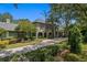 Gorgeous home with lush landscaping, a brick driveway, and a welcoming front entrance at 6352 W Maclaurin Dr, Tampa, FL 33647