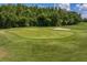 Lush golf course and sand trap, highlighting the property's desirable location and recreational amenities at 6352 W Maclaurin Dr, Tampa, FL 33647