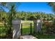 Beautiful view of the golf course adjacent to the property, framed by manicured landscaping at 6352 W Maclaurin Dr, Tampa, FL 33647