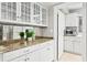 Kitchen featuring a large island, granite countertops, white cabinets, and stainless steel appliances at 6352 W Maclaurin Dr, Tampa, FL 33647