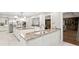 Spacious kitchen features granite countertops, stainless steel appliances and modern lighting fixtures at 6352 W Maclaurin Dr, Tampa, FL 33647