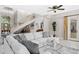 Open-concept living space with a grand staircase and stylish decor at 6352 W Maclaurin Dr, Tampa, FL 33647