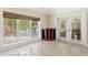 Sunlit living room with a view of the pool and outdoor area, offering indoor-outdoor living at 6352 W Maclaurin Dr, Tampa, FL 33647