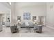 Spacious living room with soaring ceilings, neutral tones, and modern furnishings at 6352 W Maclaurin Dr, Tampa, FL 33647