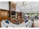 Spacious living room with stone fireplace, high ceilings, built-in bookshelves and backyard views at 6352 W Maclaurin Dr, Tampa, FL 33647