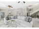 Expansive living room with elegant decor, high ceilings, and staircase view at 6352 W Maclaurin Dr, Tampa, FL 33647