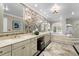 Luxury main bathroom with double vanity, soaking tub, and decorative tile work at 6352 W Maclaurin Dr, Tampa, FL 33647