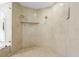 Expansive shower with dual shower heads and a convenient built-in shelf at 6352 W Maclaurin Dr, Tampa, FL 33647