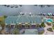 Aerial view of townhome complex with boat slips and a pool at 6414 Sunset Bay Cir, Apollo Beach, FL 33572