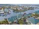 Aerial view of a waterfront condo with lush trees, canals and stunning architectural design at 6414 Sunset Bay Cir, Apollo Beach, FL 33572