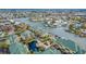 Spacious waterfront condo featuring a swimming pool, boat docks, and peaceful canal views from above at 6414 Sunset Bay Cir, Apollo Beach, FL 33572