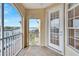 Exterior view of a screened balcony and a doorway leading back inside at 6414 Sunset Bay Cir, Apollo Beach, FL 33572