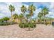 Beautiful community with palm trees, brick-paved driveways, and lush landscaping in a tropical setting at 6414 Sunset Bay Cir, Apollo Beach, FL 33572