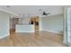 Bright living space with hardwood floors adjacent to kitchen, perfect for entertaining at 6414 Sunset Bay Cir, Apollo Beach, FL 33572