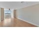 A large living room with laminate flooring, ceiling fan, and big window at 6414 Sunset Bay Cir, Apollo Beach, FL 33572