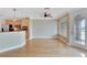 A light and airy living room with open access to the kitchen and access to a balcony with natural light at 6414 Sunset Bay Cir, Apollo Beach, FL 33572