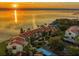 Stunning aerial view of waterfront homes with a beautiful sunset in the background at 7540 Sunshine Skyway S Ln # 217, St Petersburg, FL 33711
