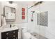 Modern bathroom with white subway tile, decorative accent tile in the shower, and a black vanity at 7540 Sunshine Skyway S Ln # 217, St Petersburg, FL 33711